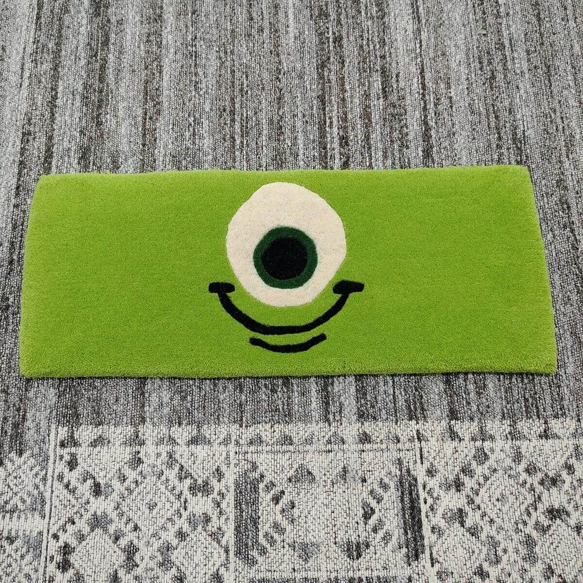 Green One-Eye Monster Cartoon Keyboard Rug — Closeup view