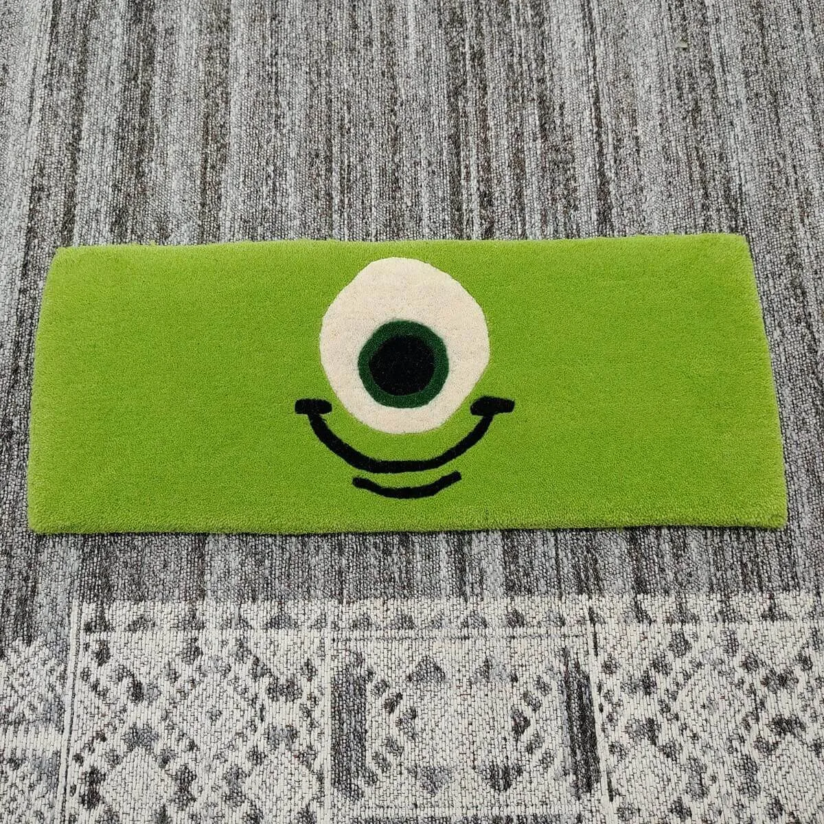Green One-Eye Monster Cartoon Keyboard Rug — Closeup view